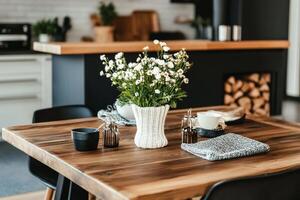 Elegant Dining Setup With Floral Arrangement in a Modern Kitchen Atmosphere. photo