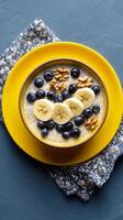 Healthy Breakfast Bowl With Bananas, Blueberries, and Walnuts Served on a Colorful Plate photo