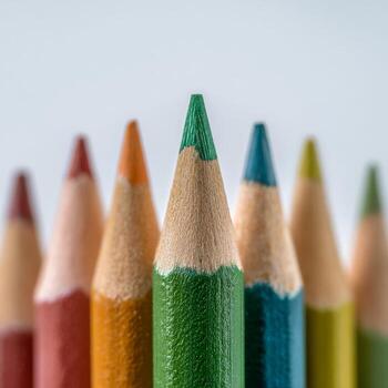 Colorful Pencil Tips Arranged in a Vibrant Display Against a Light Background photo