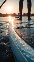 Sunset Paddleboarding on Calm Waters With Reflections in the Evening photo