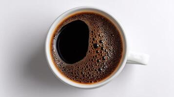 Coffee Brews With Rich Bubbles in a White Cup Against a Simple Background. photo