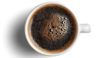 Coffee Brews With Rich Bubbles in a White Cup Against a Simple Background photo