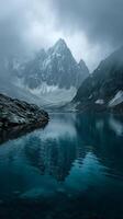 Majestic Mountain Landscape With Mist Over Tranquil Lake in the Early Morning photo