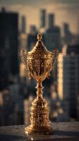 Majestic Golden Trophy Stands on Display Against a City Skyline at Sunset photo
