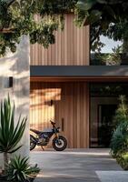 Modern Wooden House Exterior With Motorcycle and Landscaped Garden at Dusk. photo