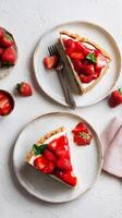 Delicious Strawberry Cheesecake Slices Served on Elegant Plates With Fresh Berries photo