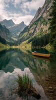 Rowing on a Tranquil Lake Surrounded by Mountains in Summer photo