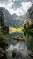 Rowing on a Tranquil Lake Surrounded by Mountains in Summer. photo