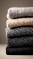 Cozy and Stylish Wool Sweaters Stacked Neatly for a Minimalist Winter Wardrobe photo