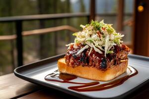 Delicious Pulled Pork Sandwich With Slaw Served on Toasted Bread in a Cozy Setting photo