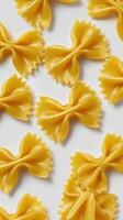 Farfalle Pasta Shapes Arranged on a Light Background for Culinary Inspiration and Food Styling photo