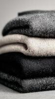 Cozy and Stylish Wool Sweaters Stacked Neatly for a Minimalist Winter Wardrobe. photo