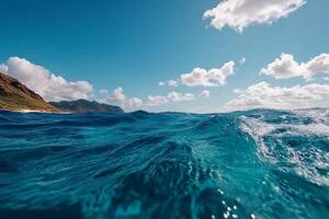Exploring the Vibrant Blue Waves of the Ocean Under a Bright Sky Near the Tropical Coast photo