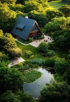 Charming Modern Cabin Surrounded by Vibrant Greenery and Peaceful Pond During Golden Hour. photo