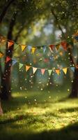 Colorful Bunting and Confetti Decorate a Sunny Park for a Festive Outdoor Celebration photo