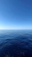 Tranquil Ocean View Under a Clear Blue Sky at Midday photo