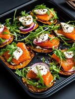 Delicious Smoked Salmon Tartines Topped With Herbs and Cream in a Modern Kitchen Setting. photo