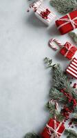 Holiday Gift Arrangement With Ornaments and Candy Canes on a Light Background photo