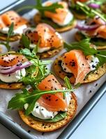 Delicious Smoked Salmon Appetizers Arranged on a Platter Ready for Serving at a Gathering photo