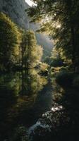 Tranquil Forest Reflection in a Serene River Surrounded by Lush Greenery at Dawn photo