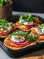 Delicious Smoked Salmon Tartines Topped With Herbs and Cream in a Modern Kitchen Setting photo