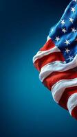 Waving American Flag Against a Blurred Blue Background in Daylight. photo