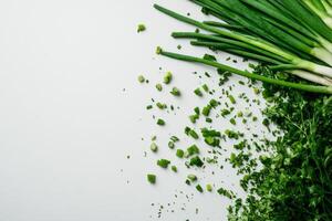 Freshly Chopped Green Onions and Parsley on a White Surface Ready for Cooking photo