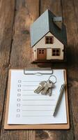 House Keys and Checklist for New Home Preparation on a Wooden Table. photo