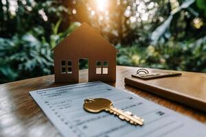 New Home Ownership Journey Begins With a Key and Contract on a Sunny Day. photo