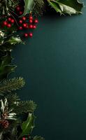 Beautiful Holly Branches With Red Berries Against a Dark Green Background for Festive Decoration. photo