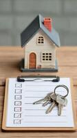 House Keys and Checklist for New Home Preparation on a Wooden Table photo