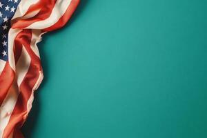American Flag Draped on a Teal Surface Creating a Patriotic Visual Contrast photo