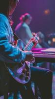 Musician Playing Electric Guitar During Live Performance in Vibrant Venue at Night photo