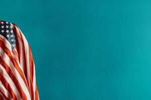 American Flag Draped on a Teal Surface Creating a Patriotic Visual Contrast. photo