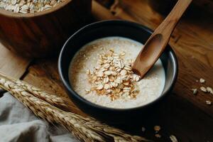 Oatmeal Bowl Topped With Flowers Alongside Grains and Oats in a Cozy Setting. photo