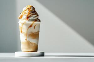 Creamy Caramel Swirl Dessert Served in a Clear Cup on a White Table With Soft Light photo
