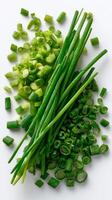 Freshly Chopped Green Onions Displayed on a Clean White Surface Ready for Culinary Use photo