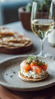 Gourmet Platter Featuring Smoked Salmon on Rye With White Wine Served in a Modern Dining Setting photo