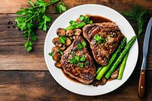Succulent Grilled Steak Served With Fresh Asparagus and Mushrooms on a Rustic Wooden Table photo