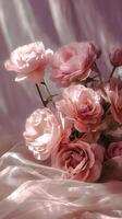 Beautiful Pink Roses Arranged Elegantly on Soft Fabric in a Serene Setting photo