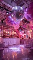 Elegant Party Venue Adorned With Pink Balloons and Shimmering Disco Ball at Night photo