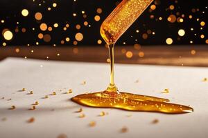 Golden Honey Dripping From a Honey Dipper on a Smooth Surface With Sparkling Particles in Soft Light. photo