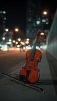 Violin Resting on the Sidewalk Under City Lights at Night photo