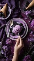 Delicious Purple Ice Cream Served With Blackberries and Flowers on a Stylish Table Setting. photo