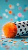 Fun Celebration Party Popper With Polka Dots and Colorful Confetti on a Bright Blue Background photo