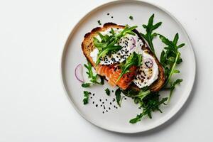 Salmon Fillet With Arugula and Black Sesame Seeds on a Minimalist Plate. photo