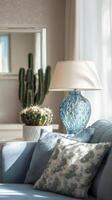 Elegant Living Room With Decorative Lamp and Potted Cactus Under Natural Light in a Cozy Setting. photo