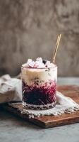 Beautifully Layered Beverage With Ice and Floral Accents Presented on a Rustic Table. photo
