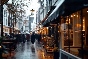 Busy Street in Amsterdam During Rainy Evening With Festive Lights and People Walking photo