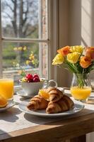 Sunny Spring Breakfast with Fresh Croissants, Orange Juice, and Flowers by a Window - Cozy Morning Meal Scene photo